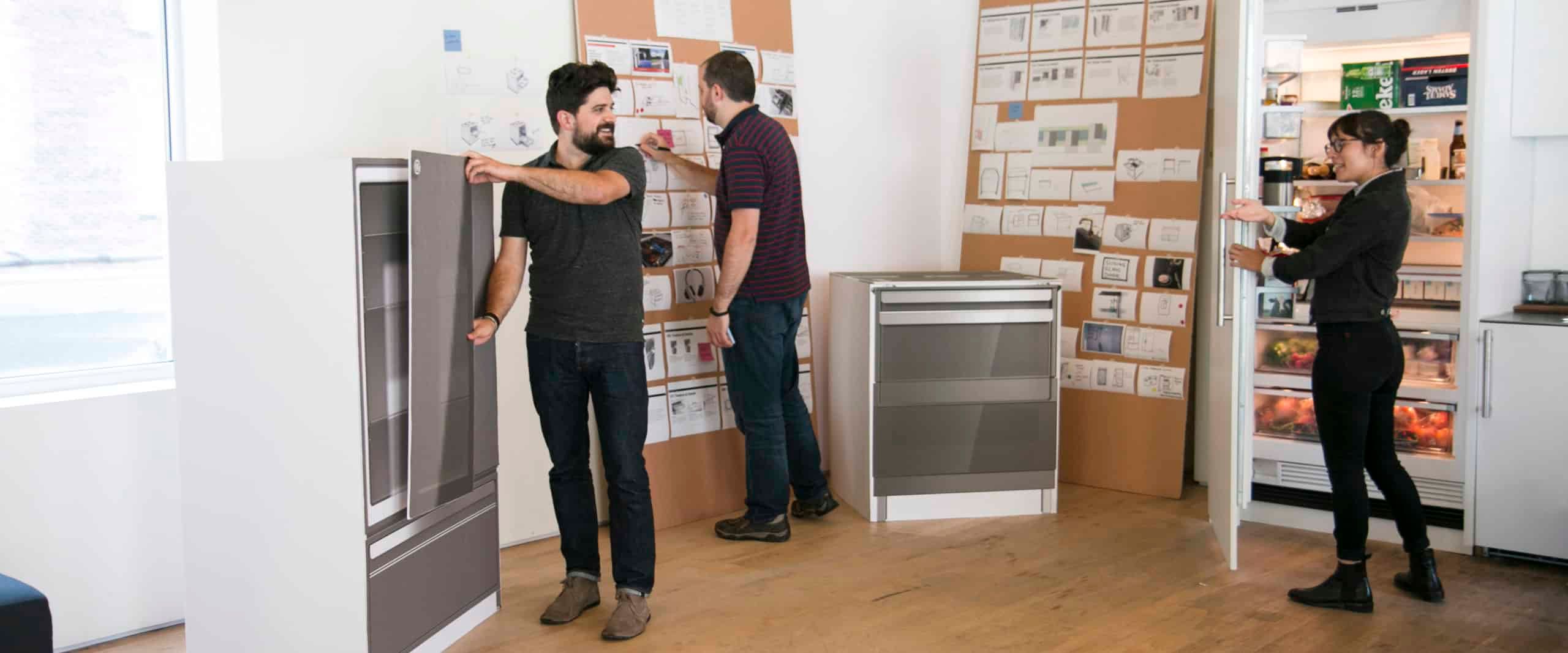 Ge Appliances Team Reviewing Appliance Prototypes And Boards